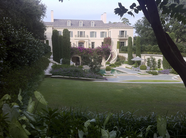 Sunken swimming pool area with Italian Cypress