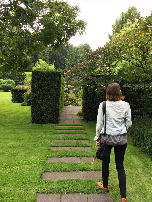 Patterned pavers in lawn lead to opening